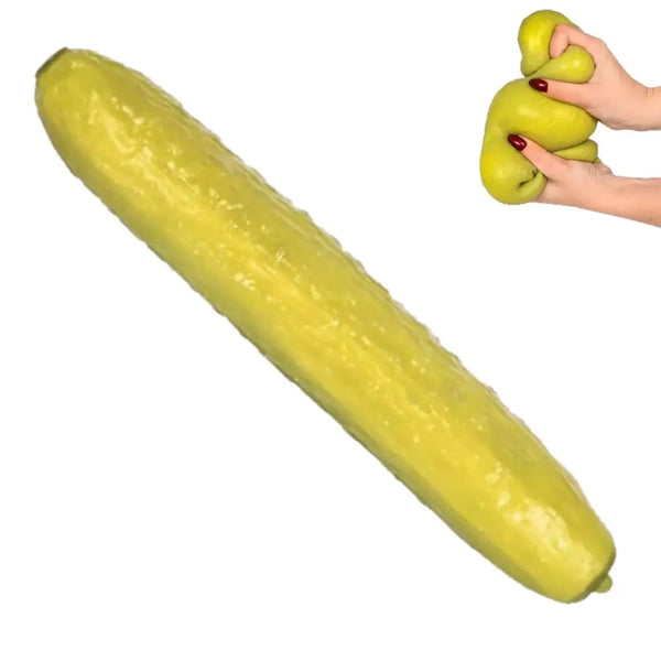 A long, yellow pickle-shaped squishy stress relief toy being held by a hand with green pickle-shaped stress balls.