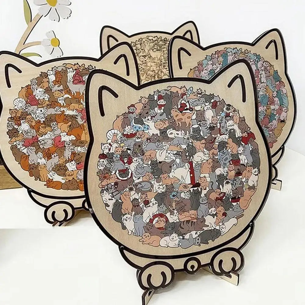 A set of three cat-shaped wooden jigsaw puzzles featuring various cats and kittens.