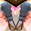 Black PU leather stroller organizer hooks with metal clasps shown in a hand.