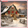 A wooden barn decorated with a wreath and lights in a snowy landscape.