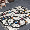 A play mat featuring a city road map design with various vehicles and landmarks for children.