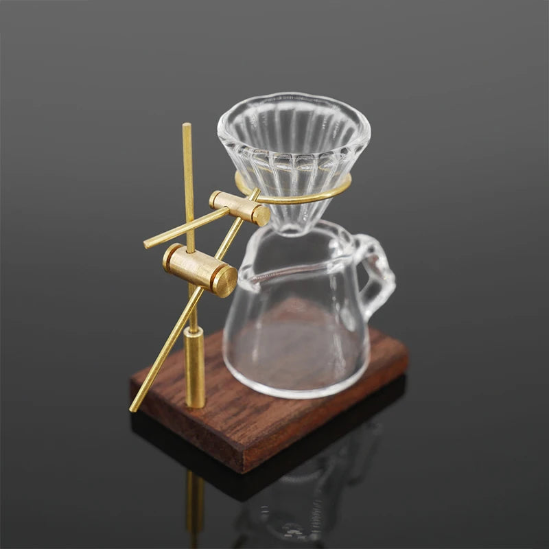 A miniature hand-brewed coffee stand set for dollhouse featuring a glass teapot and a conical strainer