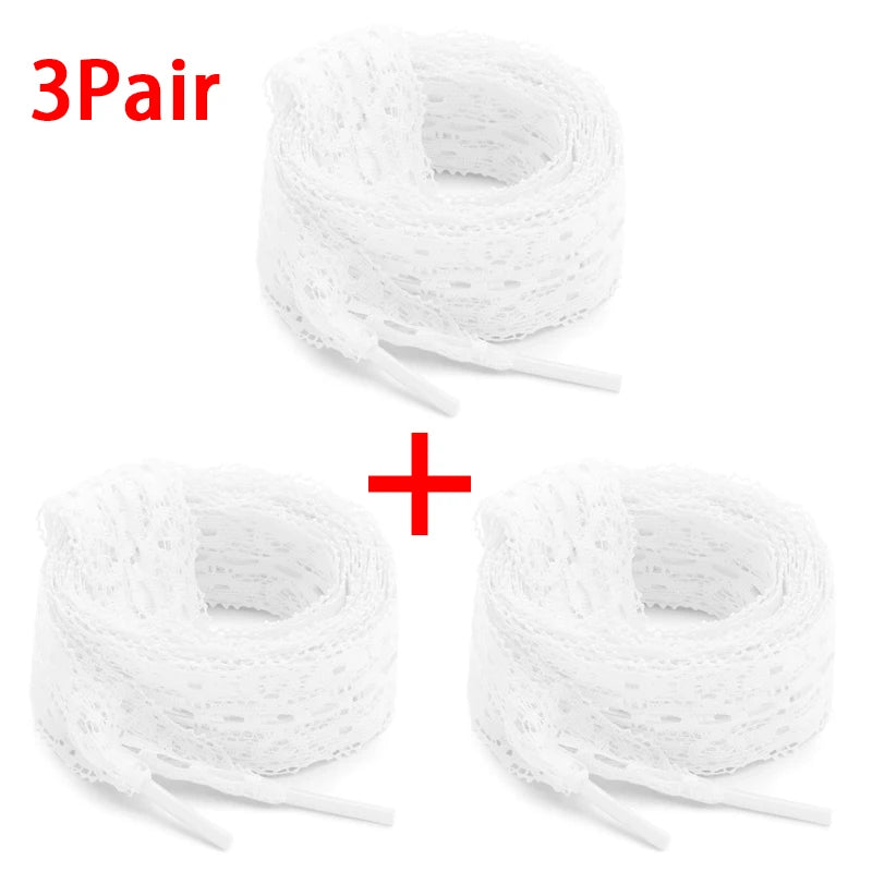 Three pairs of white 3cm wide flat elastic silk lace shoelaces rolled up