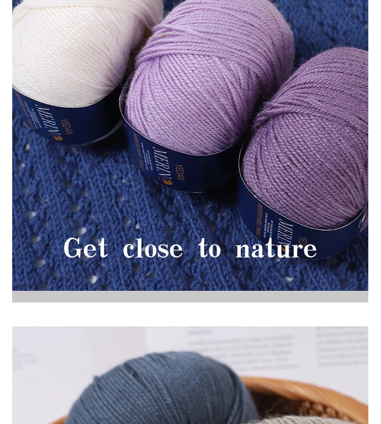 Three skeins of purple and cream wool blend yarn are displayed on a blue textured background.