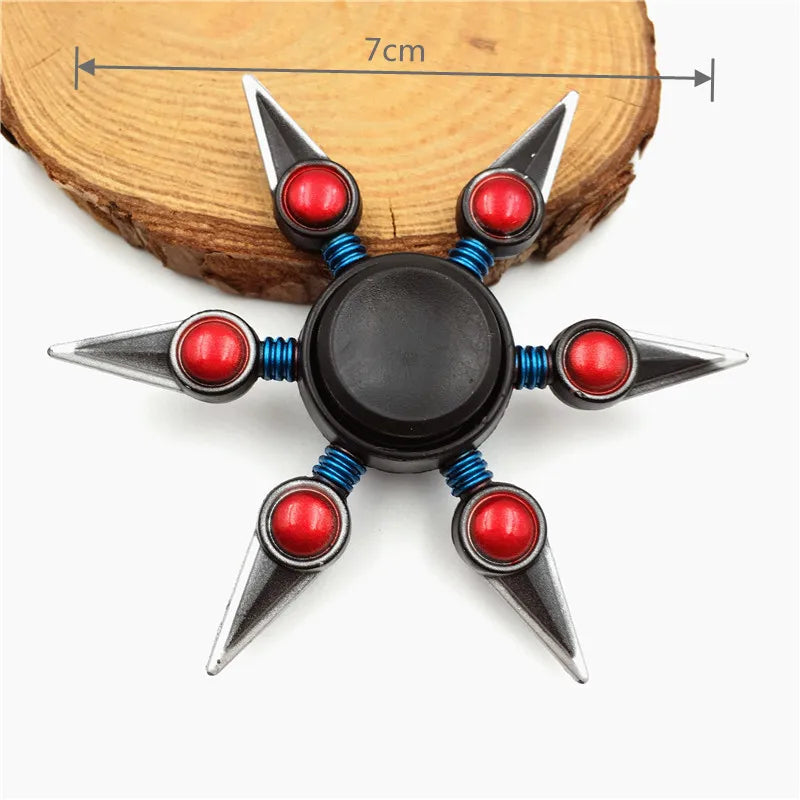 A metal fidget spinner with a rainbow finish, featuring black and silver components.