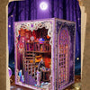 A detailed box kit for a tarot association book nook featuring intricate purple and gold designs with internal LED lighting.