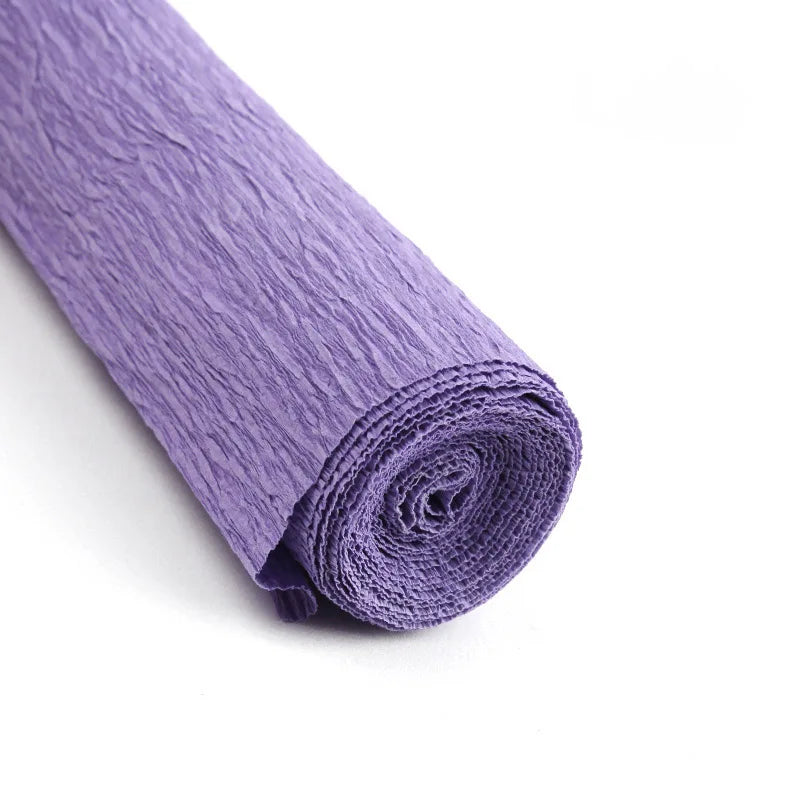 A roll of purple crepe paper for DIY crafts and gift wrapping.