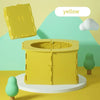 A yellow foldable baby potty training seat is shown on a white stand against a light green background.