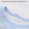 Close-up of a light blue baby bib showing a double snap fastener adjustment feature.