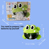 A green frog bubble toy with large eyes and a clear dome, shown next to its packaging.