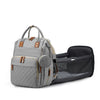 A gray premium diaper backpack with a padded changing station and multiple compartments.