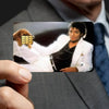 A close-up photo of a person holding a credit card decorative sticker set featuring a portrait of Michael Jackson.