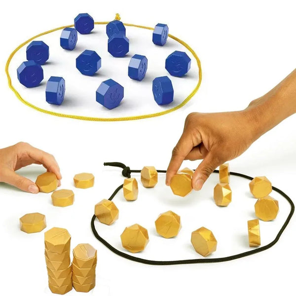 A hand places magnetic strategy game pieces onto a circular board, showing various blue and gold geometric shapes.