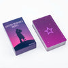 A purple box of the Lovers Messages Oracle deck with a silhouette of two figures and a star design.