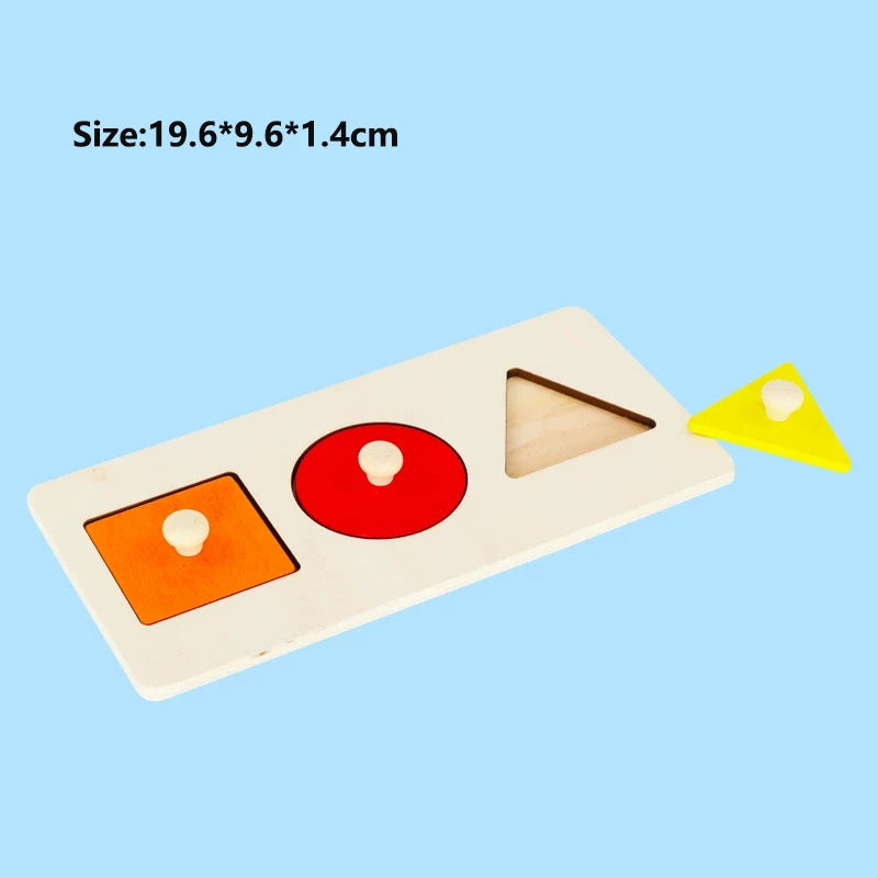 A wooden shape and color sorter puzzle with red and orange shapes on a light wood board.