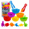 A colorful set of pom-poms in various colors like purple, orange, yellow, and green, along with blue tongs and bowls for sort