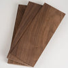 A stack of handcrafted black walnut wood boards for engraving and DIY projects.