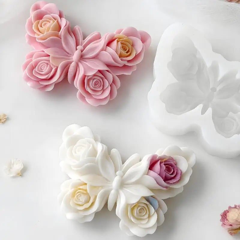 Pink and white silicone molds shaped like roses and butterflies for candle making and DIY crafts