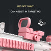 A pink red dot sight is mounted on a white water blaster, designed to assist in targeting.
