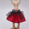 A fashion set for a doll featuring a red skirt with black lace trim and sheer netting.