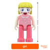 A pink magnetic building block figure of a girl with blonde hair and a smiling face.