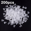 A pile of 200 clear silicone earring backs for secure stud closure.