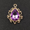 Gold plated water droplet charm featuring a purple crystal rhinestone flower.