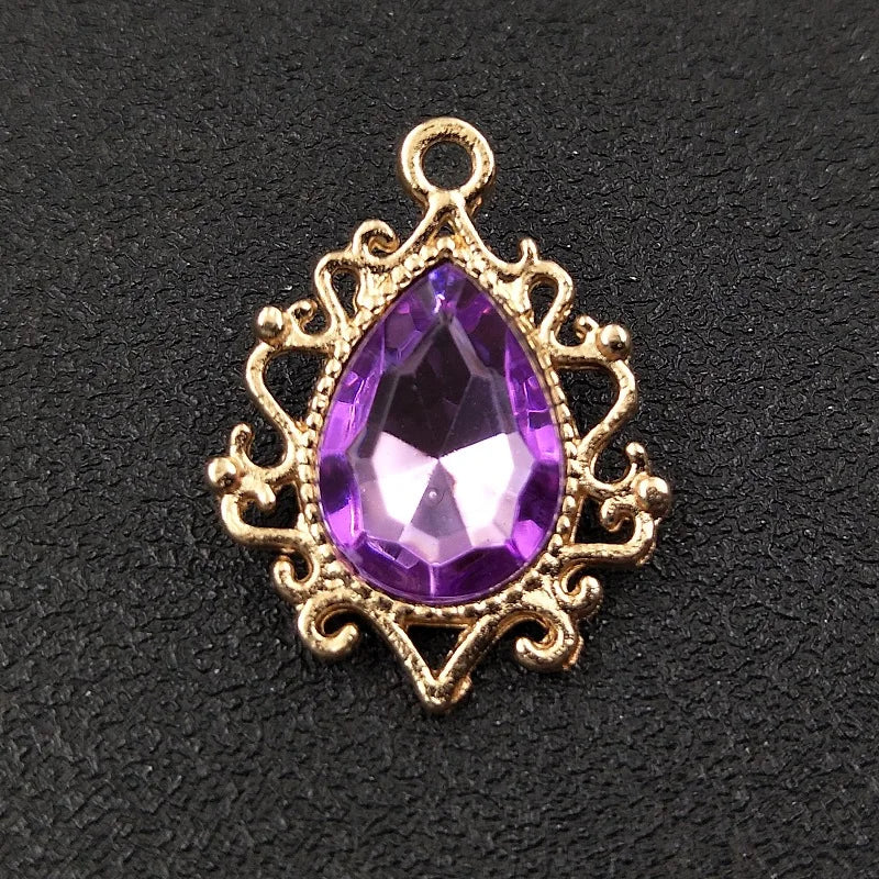 Gold plated water droplet charm featuring a purple crystal rhinestone flower.