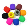 A collection of colorful foam windscreen pop filter covers in various colors including red, purple, brown, orange, green, and