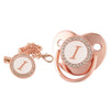 Rose gold bling baby pacifier clip with silicone holder featuring a decorative initial