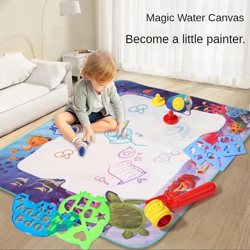 A child is drawing on a large magic water canvas mat with various pens and colorful items.