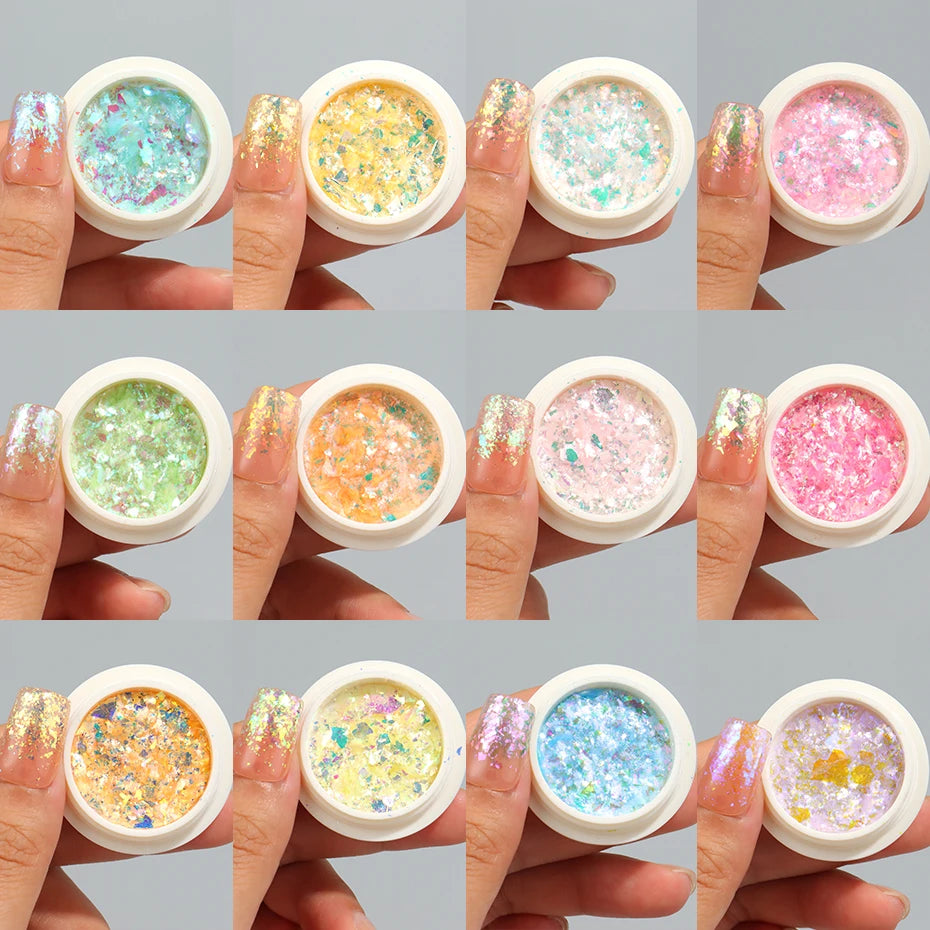 A set of iridescent opal and mermaid chrome nail glitter pigments shown on fingernails.