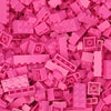 A pile of pink building blocks used for creative DIY projects.