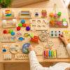 A wooden Montessori busy board for toddlers featuring various sensory activities like gears, switches, and colorful component