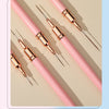 A set of precision nail art liner brushes in pink and gold are displayed on a light background.