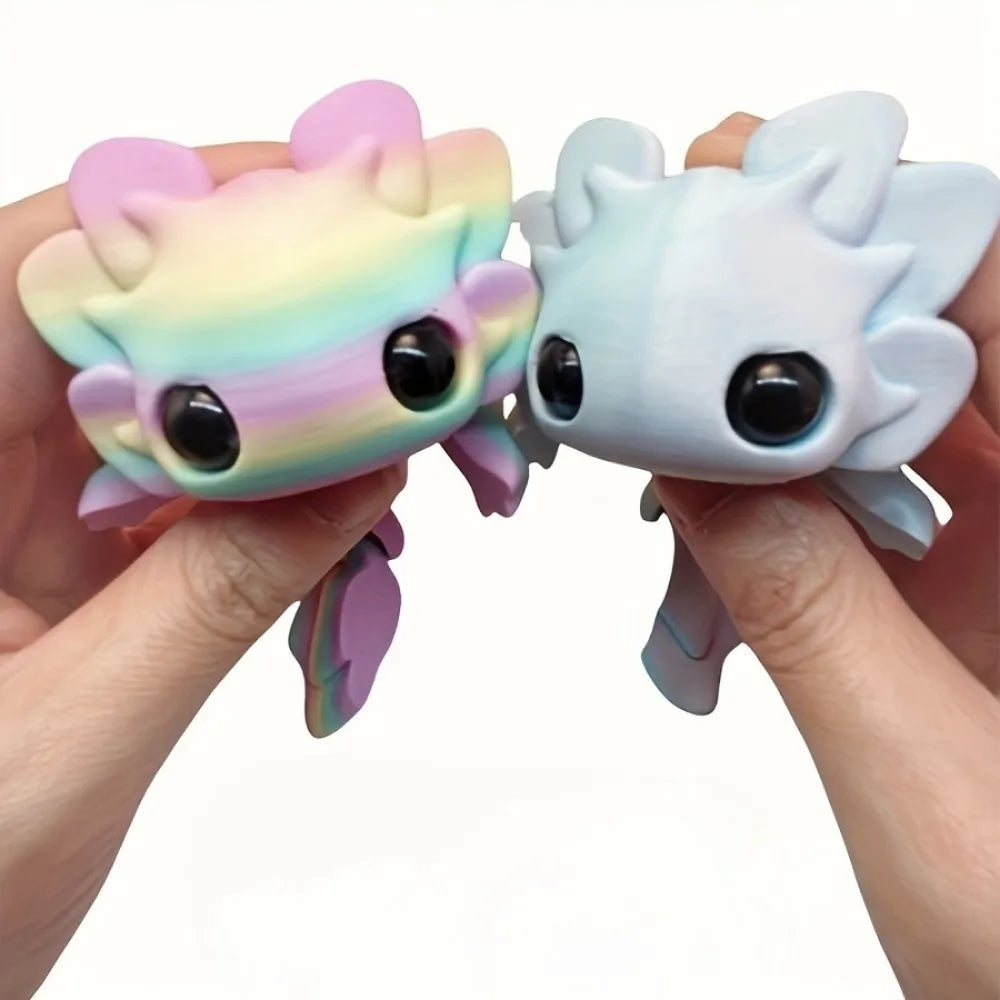 Two pastel colored flexible salamander figurines are held in a person's hands.