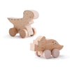 A wooden dinosaur teether toy car made of light wood.