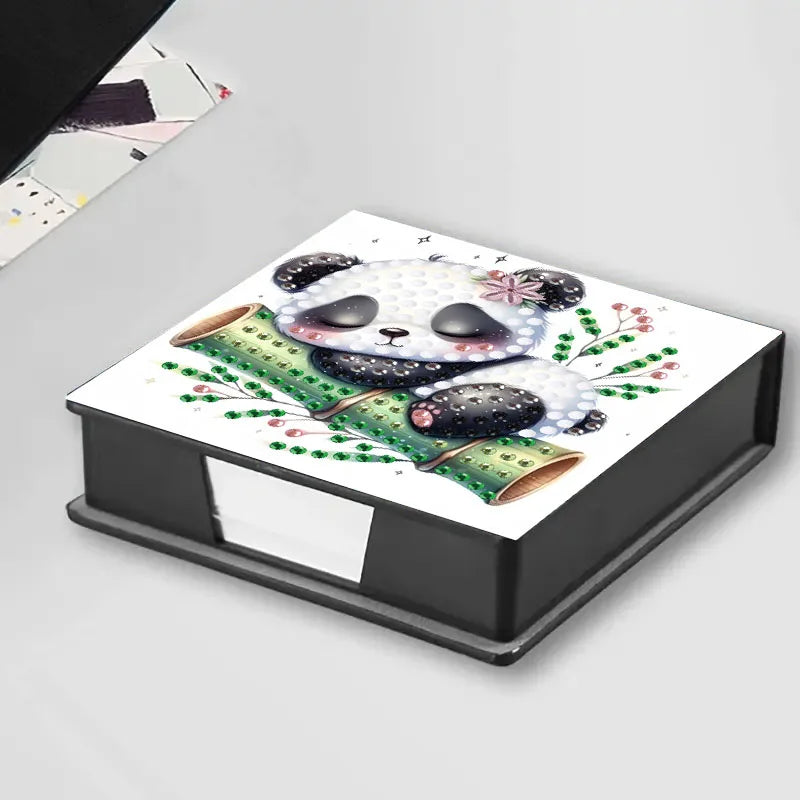A storage box for a DIY diamond painting kit featuring a panda animal pattern with gemstones.