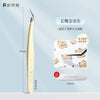 A pair of long stainless steel tweezers used for sticker crafting, shown next to a small bear-shaped object.