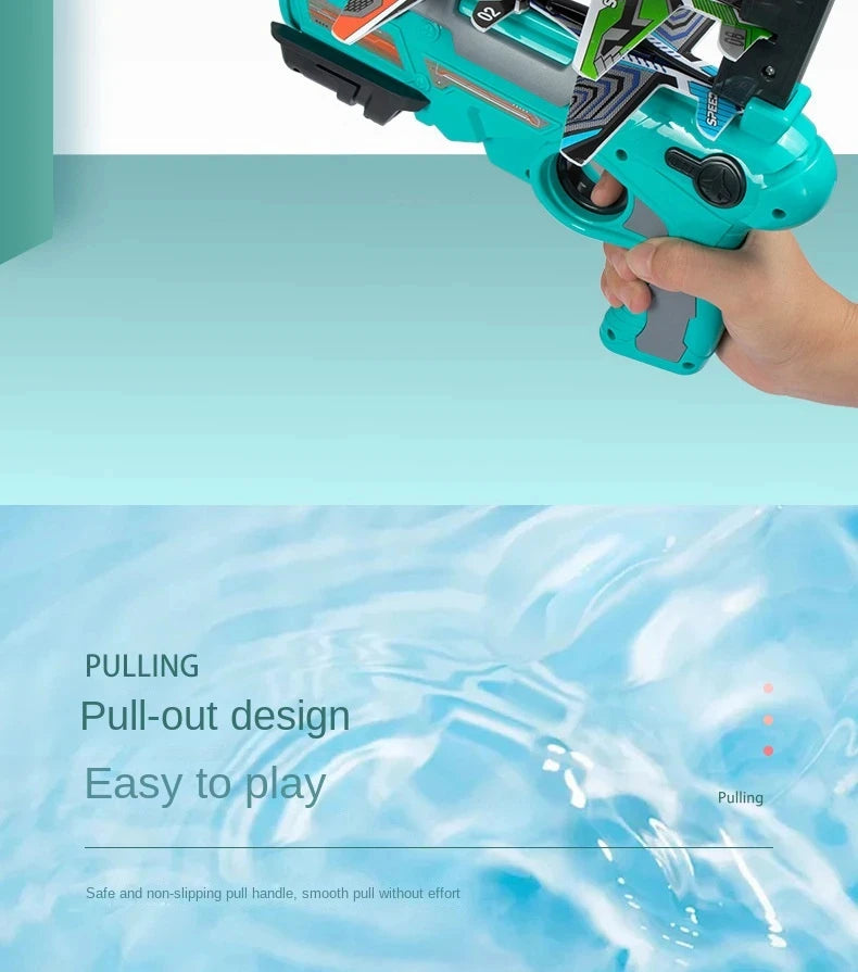A hand holds a teal airplane launcher toy with foam planes, demonstrating its pull-out design.