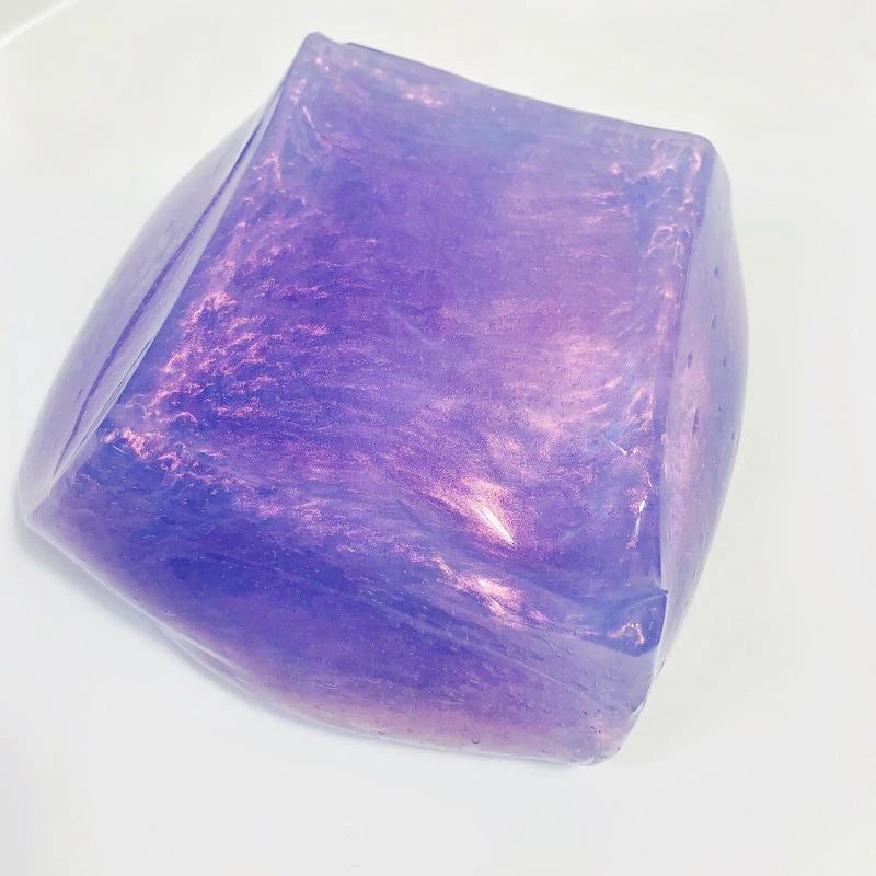 A translucent purple crystal block used for stress relief or slime.