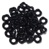 A pile of black acrylic spacer beads shaped like doughnuts for jewelry making