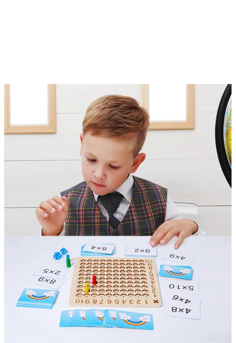 A young boy is shown interacting with a wooden Montessori multiplication board game featuring colorful tiles and numbers.