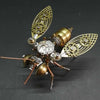 A detailed steampunk mechanical bee model kit featuring brass and silver metal parts.