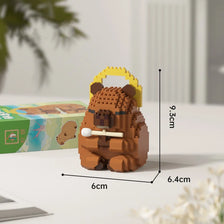 A small, brown wooden building block model of a bear, packaged in its original box.
