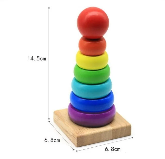 A stack of six colorful wooden geometric shapes, stacked vertically on a light wooden base.