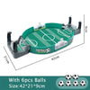 A portable tabletop foosball game featuring a green field and black rods, with six balls included.