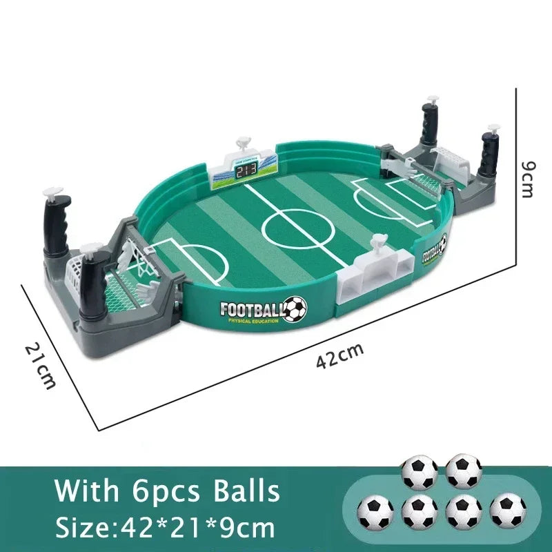 A portable tabletop foosball game featuring a green field and black rods, with six balls included.