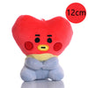 A red, heart-shaped mini plush keychain with yellow accents and blue feet.