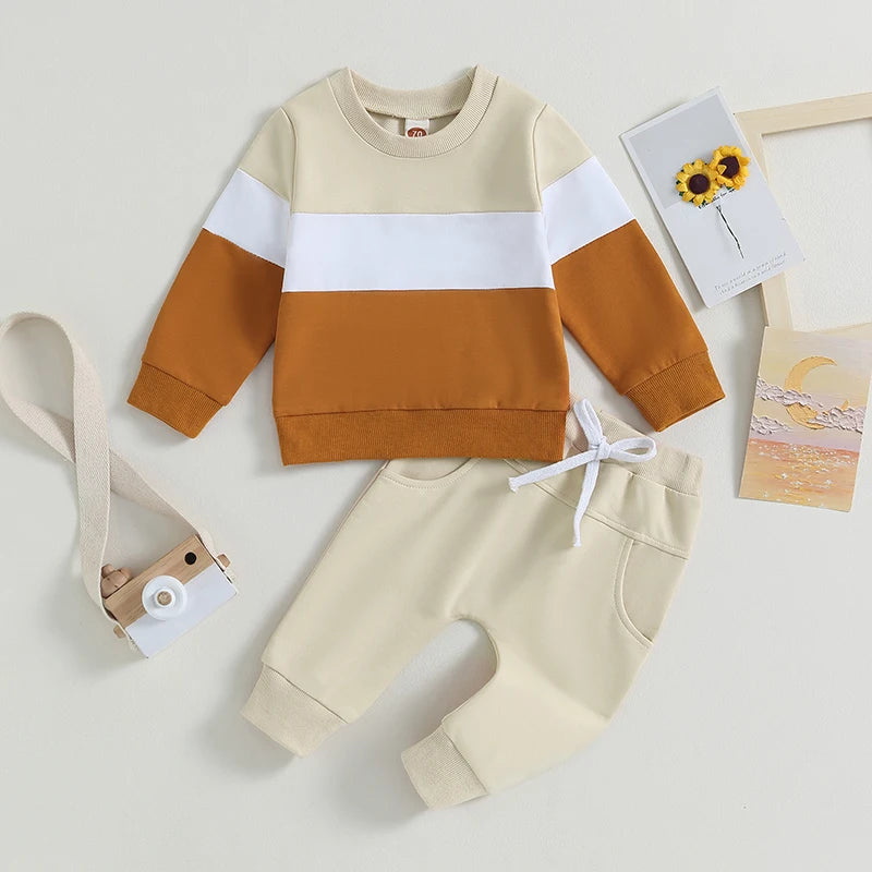 Toddler boys color block sweatshirt and pants set in beige, white, and burnt orange tones